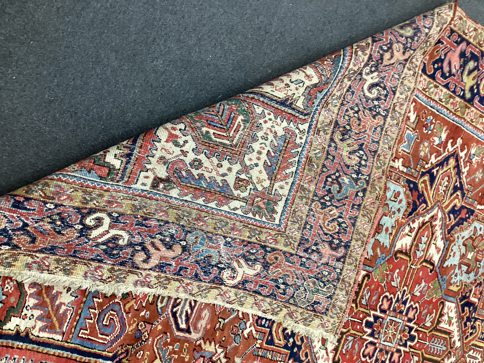 An early 20th century Heriz red ground carpet, 336 x 250cm